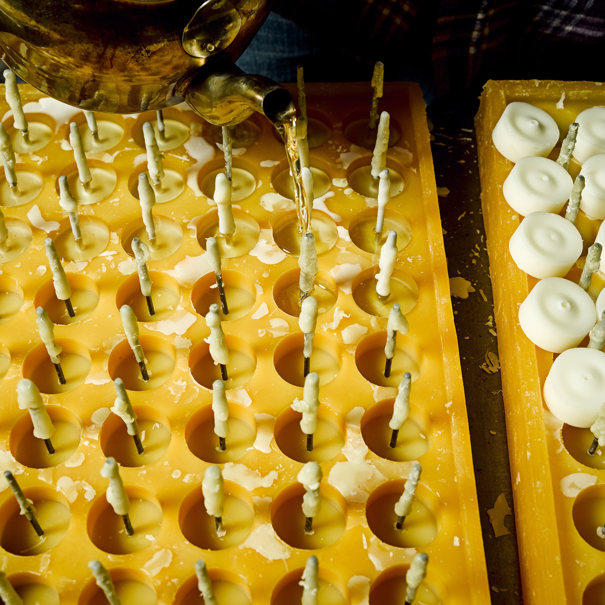 Pouring scented beeswax tea light candles